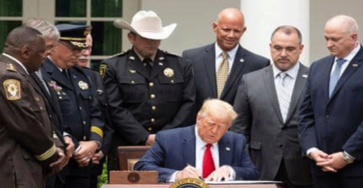 Trump signs new police reform that'll ban choke holds unless an officer’s life is in danger after weeks of protests about racial injustice
